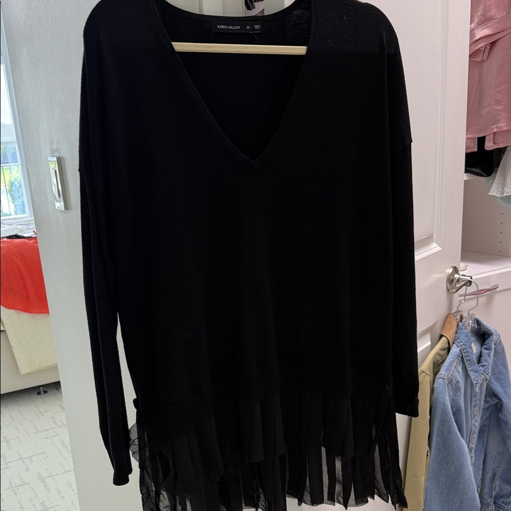 Black V-Neck Sweater with a very stylish hem